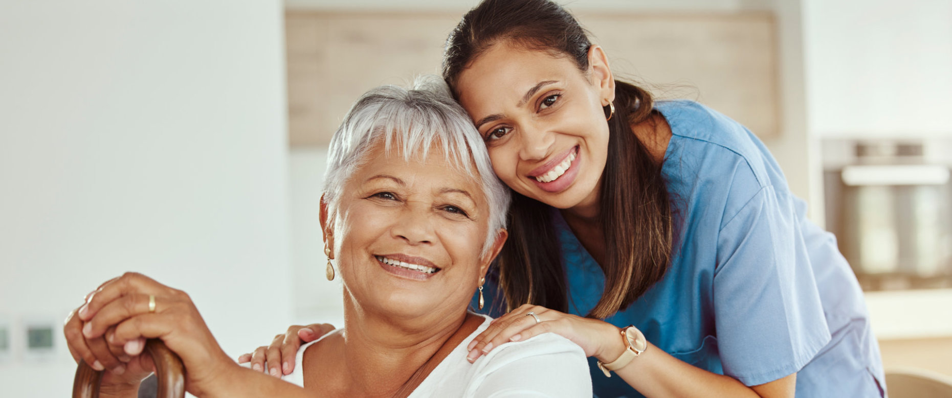 caregiver and senior smiling