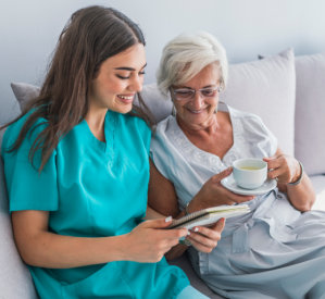 caregiver and senior smiling together