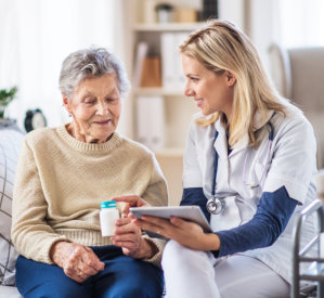 Caregiver talking with senior woman