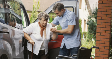 Male nurse assist the elder woman