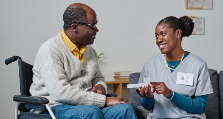 Female nurse taking care of the senior woman at home