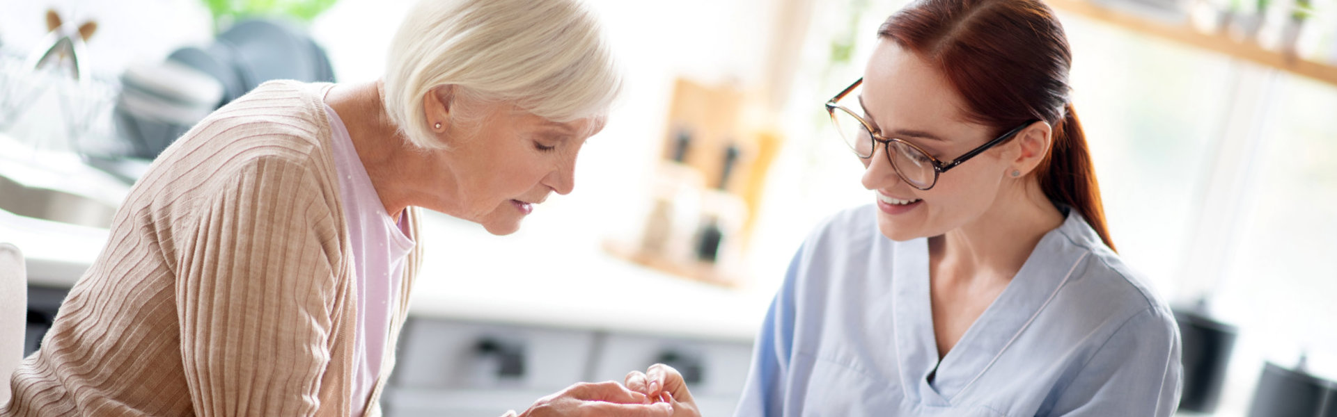 Medical nurse gave a medicine to the elder woman